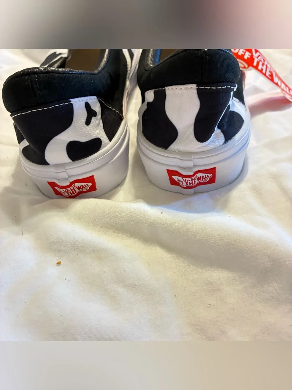 Vans Slip-On Sneakers in Black & White Cow Pattern